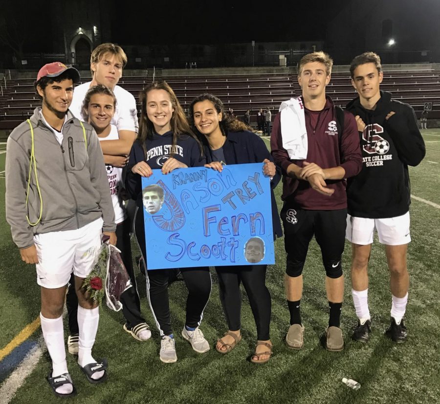 Soccer+seniors+pose+with+their+fans+after+their+2-0+victory+over+Altoona.