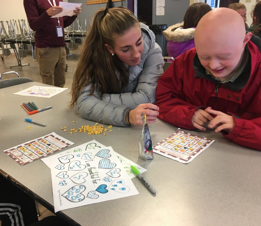 Seniors, Esther Seeland and Sam Moyer, enjoy each other’s company while playing Thanksgiving-themed bingo. Esther said Best Buddies is a, “a great experience and you get to know people you don’t normally spend a lot of time around.” Best Buddies continues to provide a welcoming environment for all students to make new friends and have fun!