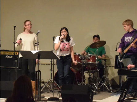 Everyone needs to let loose once in a while, and that’s exactly what senior Kristina Hughes and her bandmates did at their master class with Chris Farmer. Here Hughes, (second from left), sings with her bandmates, Emily Lieb, senior, Sean Cunningham, junior, and Ezra Raupach-Lear, junior. “I’m still debating whether or not I want to do lacrosse, or the glee club when I get there [West Point], but both are high priority, I’ve been talking with the lacrosse coaches and it seems like a positive group for me to take, but I also really like music. It’s a big conflict but whatever I do I’ll be happy” said Hughes.
