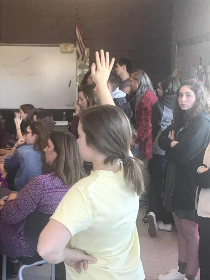 Students raise their hands to discuss the gathering being planned for March 14th. Photo by Joie Knouse