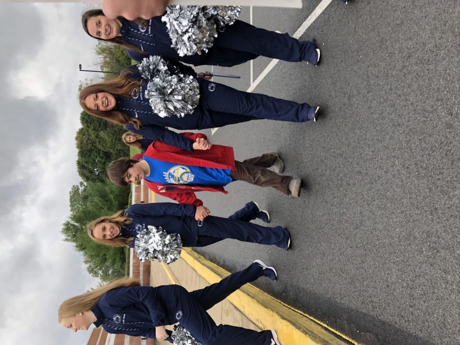 Penn+State+Dance+Team+Members+walk+alongside+a+participant+of+the+Buddy+Walk+on+October+20th.+The+Buddy+Walk+was+successful+fundraiser+for+the+The+Centre+Region+Down+Syndrome+Society.+Chloe+Bevilacqua%2C+senior%2C+said%2C+%E2%80%9CIt+was+amazing%21+I+am+so+impressed+with+the+community+involvement+for+the+Buddy+Walk+as+well+as+the+number+number+of+people+from+State+High+Best+Buddies+who+came.%E2%80%9D