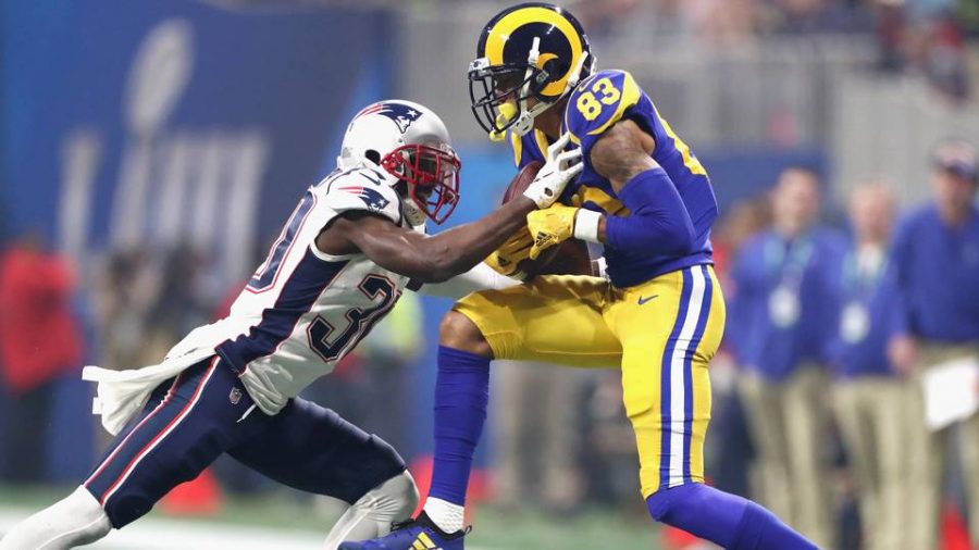 Rams receiver Josh Reynolds hauls in a pass over Patriots safety Duron Harmon