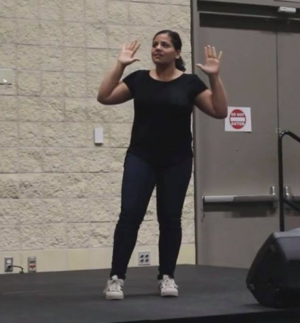 Gigi Gallegos taking part in a sign language competition. 
