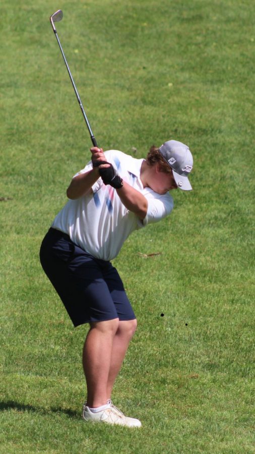 Sophomore+John+Olsen+takes+a+swing+during+a+round+of+golf.+He+finished+first+place+in+the+Individual+District+Championship+this+season.+%E2%80%9CI+remember+being+frustrated+on+the+first+6+holes+because+nothing+was+going+my+way...but+I+just+kinda+relaxed+and+realized+I+was+five+strokes+back+of+the+leader+and+anything+could+happen%2C+Olsen+said.+I+remembered+just+to+fight+for+that+second+spot+to+go+to+regionals.