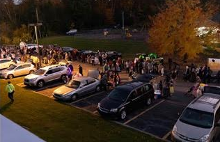 Families gathering at State College Assembly of God for a fun night at Trunk-or-Treat. 