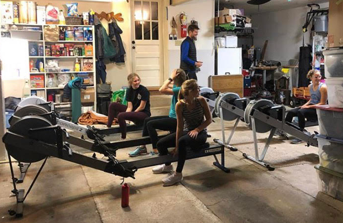 Crew team starting up their first practice on the ergs in Wyckoffs garage. The girls started off with an intense sprint pyramid. John OBrien, the head coach always says, Its a beautiful day for rowing. 