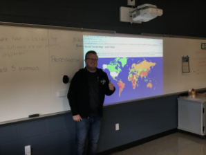 9th grade World History teacher Mr. Kimbro in front of the Fan Geo countries. “When we first did Fantasy Geo in class, it felt like a nice break from the usual note-taking routine,” Nicholas Sloff, a freshman in Mr. Kimbros world history class, said.