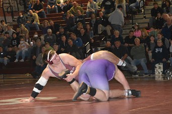 Junior Harrison Schoen grapples with his opponent in the 285 lb weight class in Thursday’s home meet against Mifflin County. State High lost the match 36-29 despite mounting a comeback after being down 29 points at intermission. “We lost, but our guys wrestled their hearts out,” sophomore Luke Banker said.