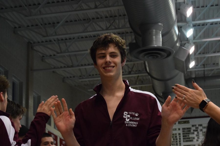 State College Diving senior Marcus Wheeler gives his teammates high fives in celebration of the Swimming/Diving Senior Night on January 23. Senior Night was created in recognition of the seniors who serve as captains, leaders, and role models on the team, and has become an annual holiday for State High Swimming and Diving. The night included a photo slideshow, videos, speeches, gifts, and snacks, all in honor of the team seniors. “The best part of being a senior this season has been getting to know the underclassmen that will become the future of the team. Im glad I got to share this final year with my fellow seniors and its incredible to see how far weve come,” Wheeler said.