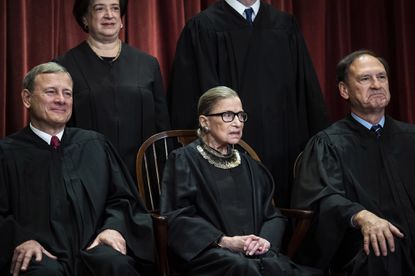 Ruth Bader Ginsburg sitting while posing for a Supreme Court picture on Nov. 30, 2018. 