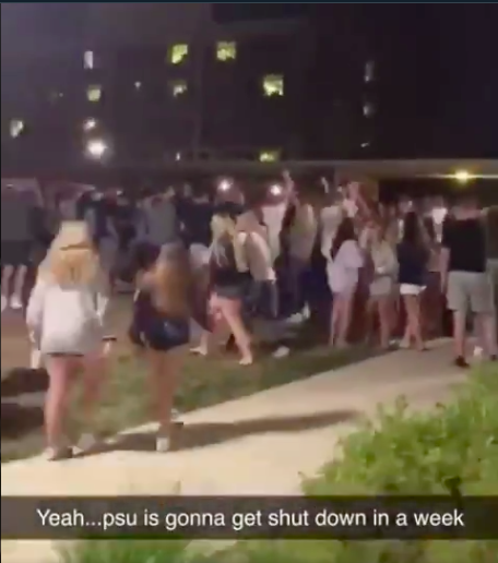 Penn State freshmen gather in large groups outside of East Halls on August 19, 2020. Despite the local town’s ordinance concerning large gatherings and required face coverings, students were found to be gathering in large groups without masks as soon as they returned to campus. 