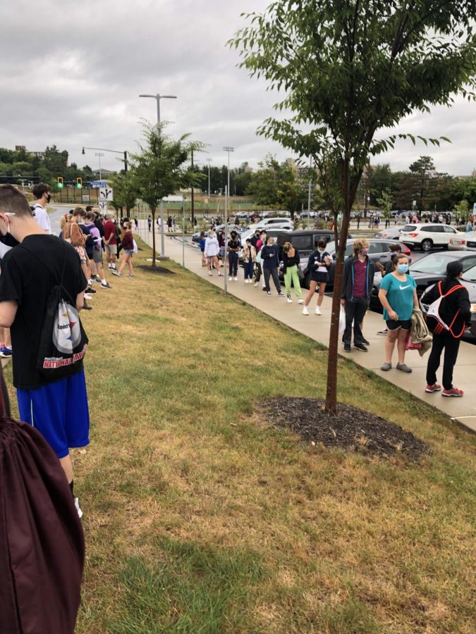 470 students wait to enter the SAT test administration outside State High on the morning of August 29, 2020.