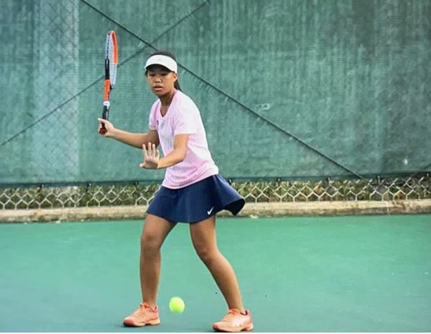 Quiana+Guo+competing+in+her+singles+district+finals+on+Sept.+30.