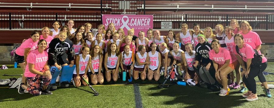 State+High+Field+Hockey+team+after+their+Stick+It+To+Cancer+game+on+Oct.+6+in+front+of+the+Stick+It+To+Cancer+sign.