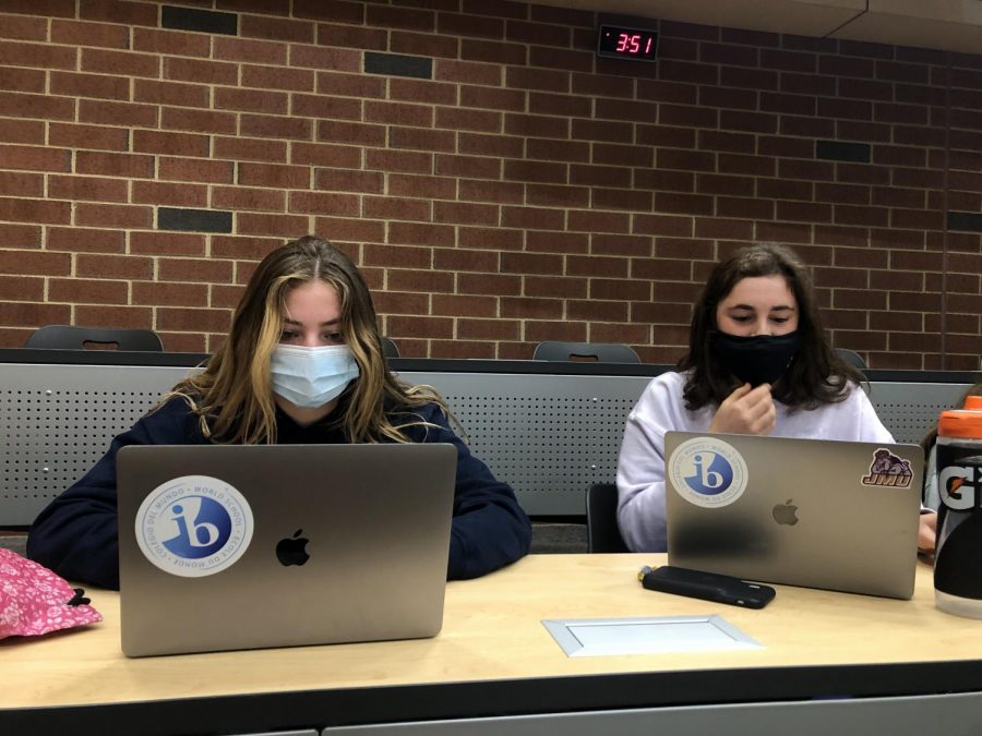 IB students Phebe Herlocher, senior, and Molly Schreiner, junior, cut down their workload by utilizing study time. “It’s easy to stay on top of things if you stay organized and write yourself fake deadlines,” Herlocher said.