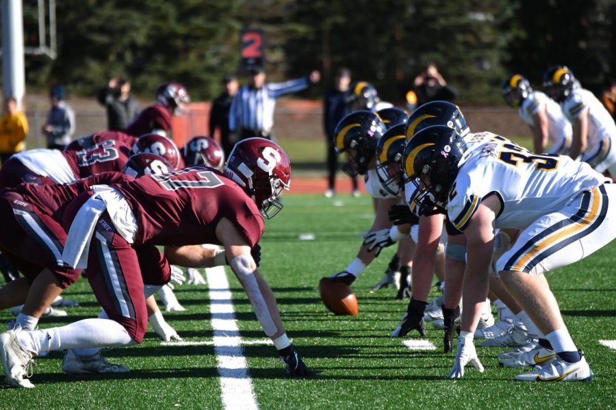 The Little Lions and Blue Devils square up at the start of a play at Mansion Park, Altoona, on Saturday, Dec. 4. 
