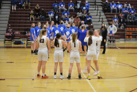 The State College Girls Basketball team introduces their players while other team members wear Rally for Rudy t-shirts on the sidelines on Tuesday, Jan. 25, at the Blue-Out game. 