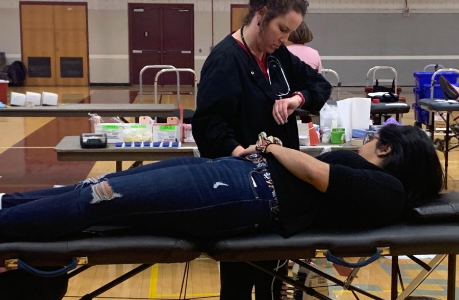 Mishika Mehta, a former State High student, donates blood at Key Clubs 2020 blood drive. 