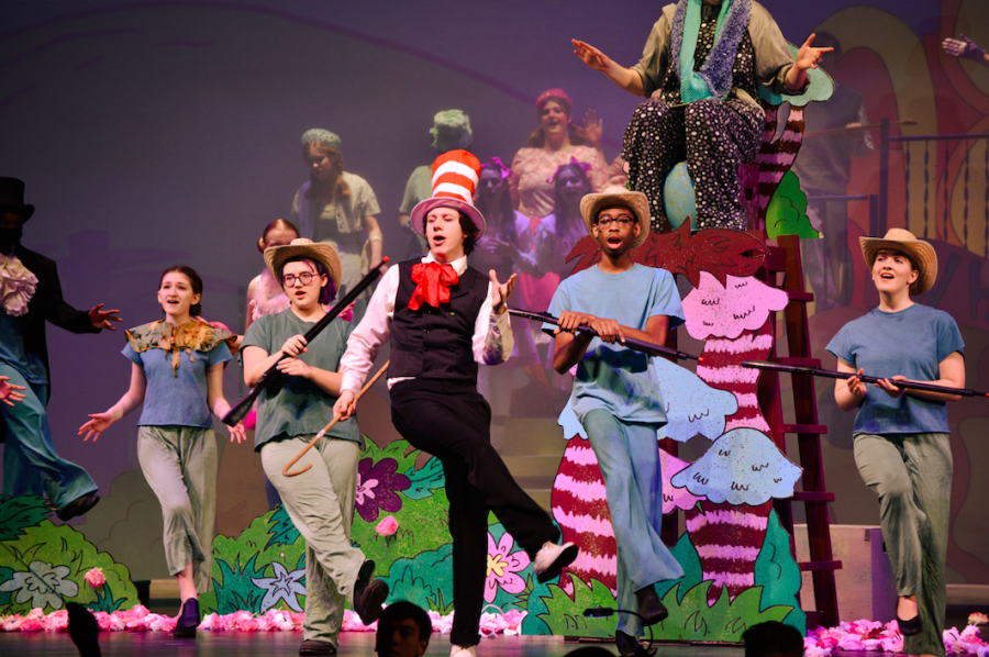 Senior Logan Glaze, who plays The Cat in the Hat, dances with Hunters on stage. Taken in the State High Performing Arts Center on Thursday, Mar. 31. 