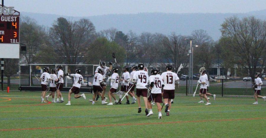 State+High+Boys+Lacrosse+team+running+to+celebrate+their+victory+at+the+North+Field+on+Tues.+May+3rd.+