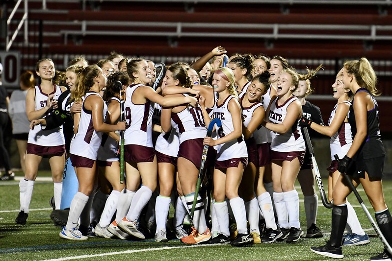 State College Field Hockey Team celebrating after the game-winning goal scored by senior Quinn Colburn. Photo by Jeffery Shomo.