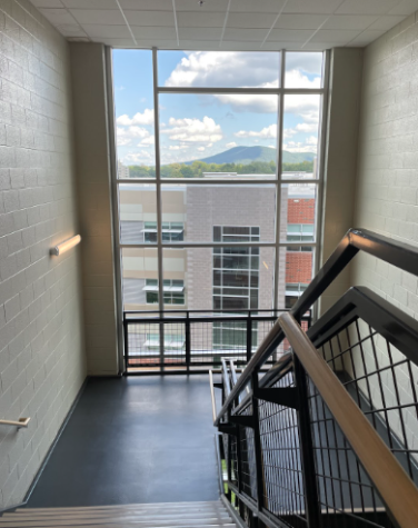 Newly renovated State High building stairwell overlooking school and landscape around it.