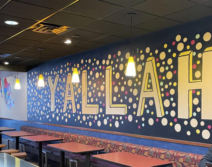 Wall of newly established Yallah Taco that Hitham’s family helped work on. His daughter painted this wall and is one of the many familial and local touches in the building. 
