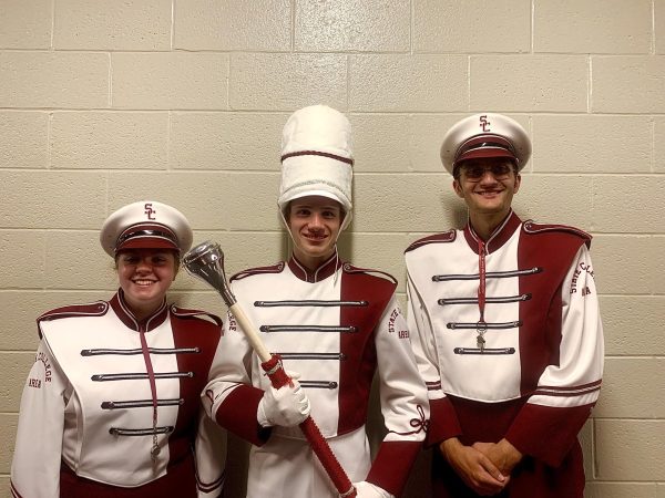 The Drum Majors-- Abby Putnam, Joshua Carlson, and Spencer Hardyk -- in the music wing after the first football game of the 2023-2024 season. Photo taken on Sept. 1, 2023