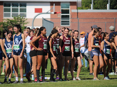 Girls varsity team prepping at the starting line
