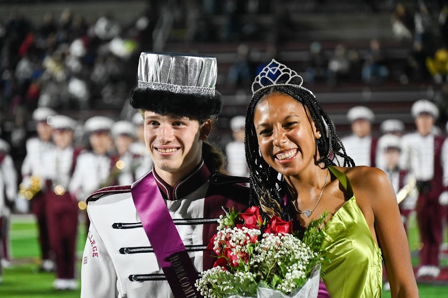Joshua Carlson and Chloe Poindexter pose for a photo on Memorial Field after being crowned Homecoming King and Queen. 