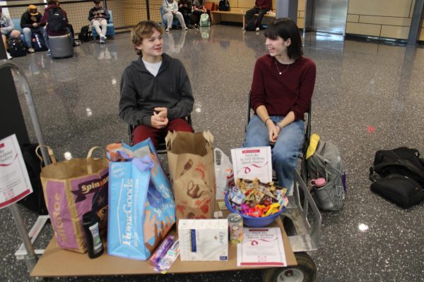 Gabriel Geiger and Isabel Olson handling donations.