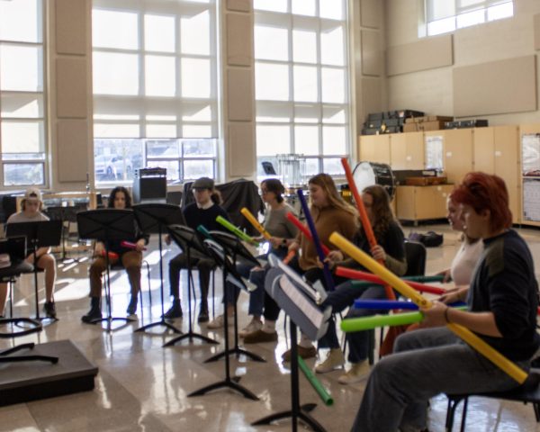 Members of State High Boomwhackers practice together before school. 