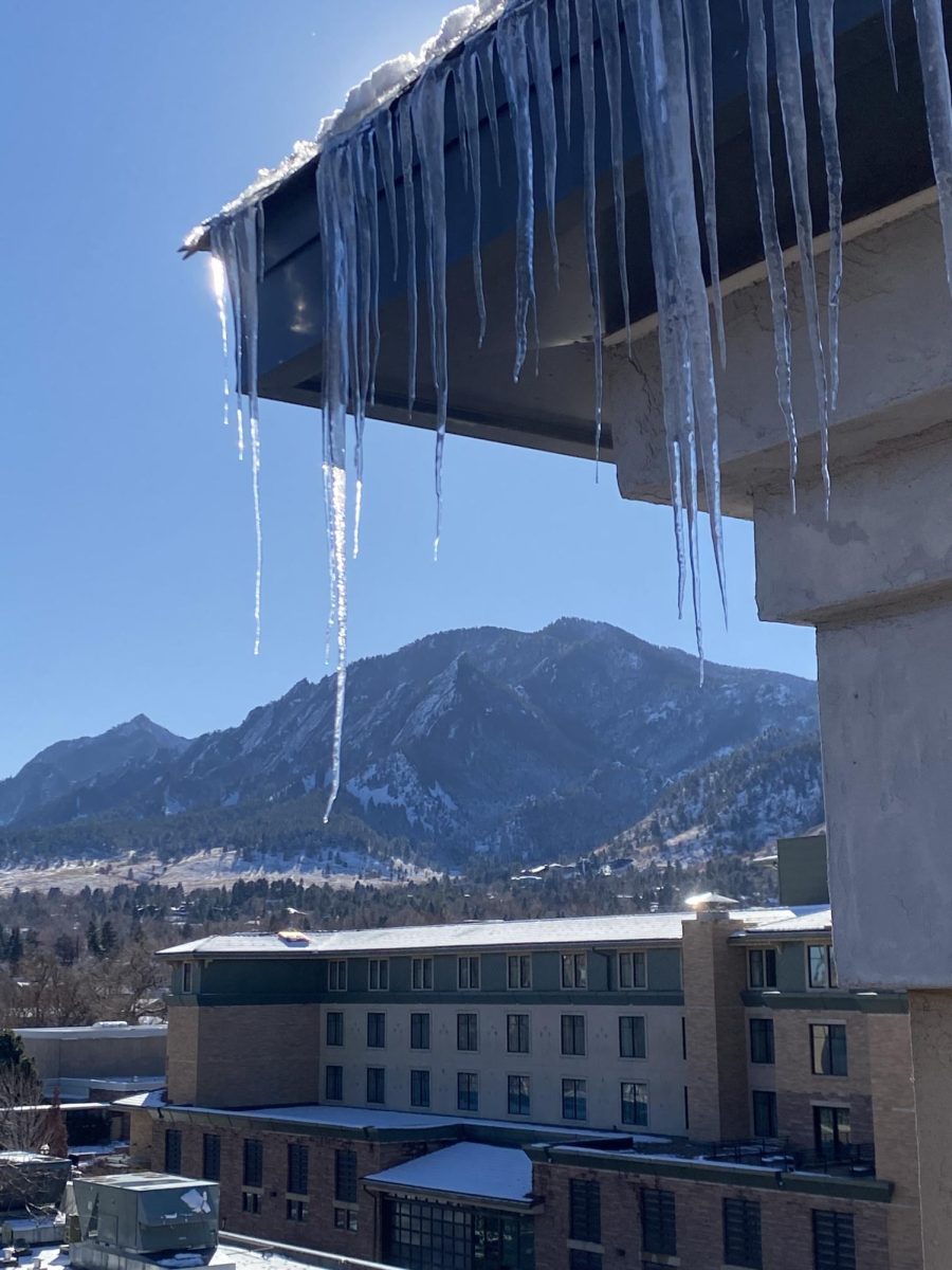 A mountain in Boulder, CO Icicles droop in front of a mountain in Boulder CO.