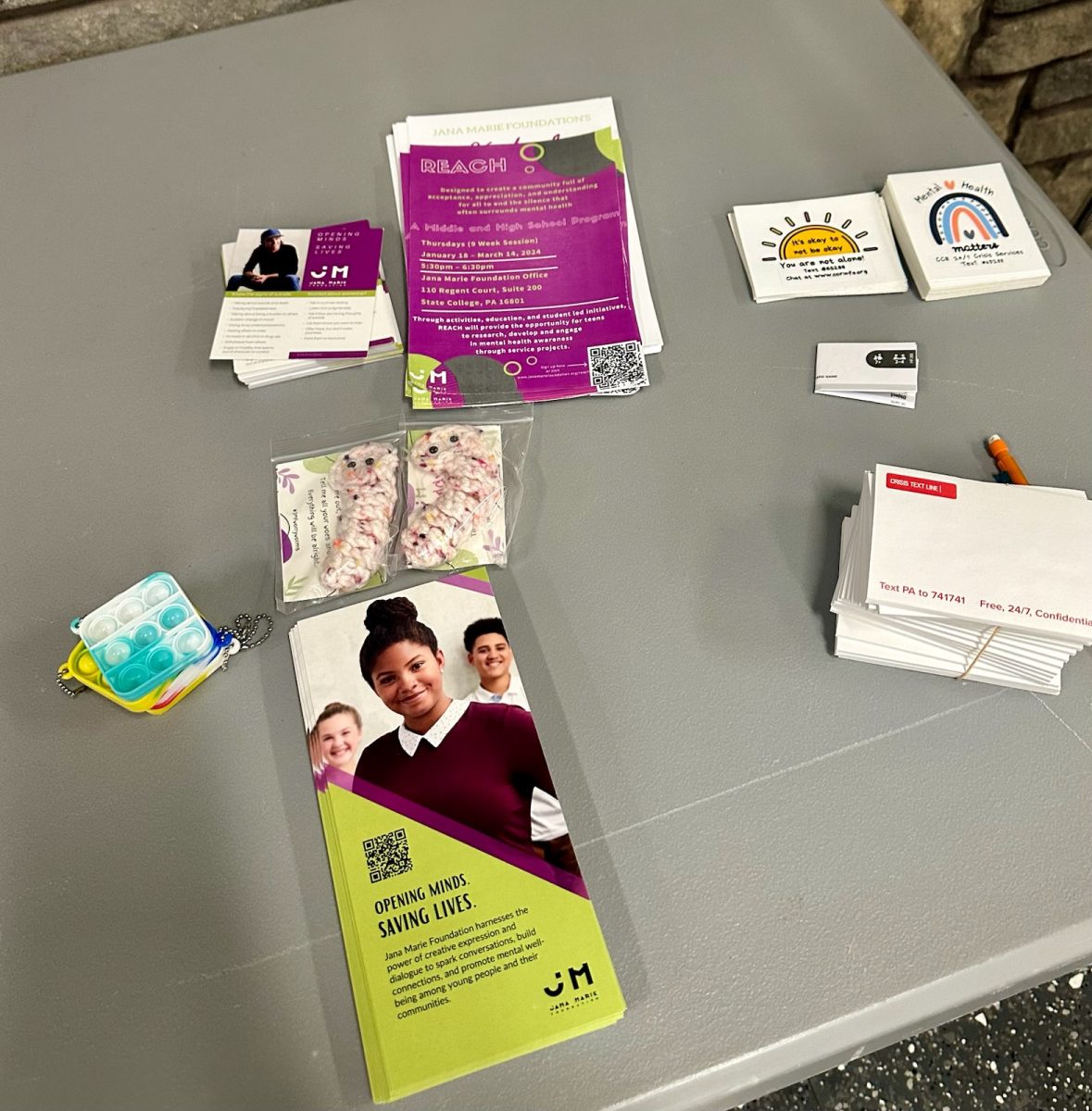 Set up at the mental health discussion with contact information and stress toys Feb. 5, 2024 (Heidi Egerer)