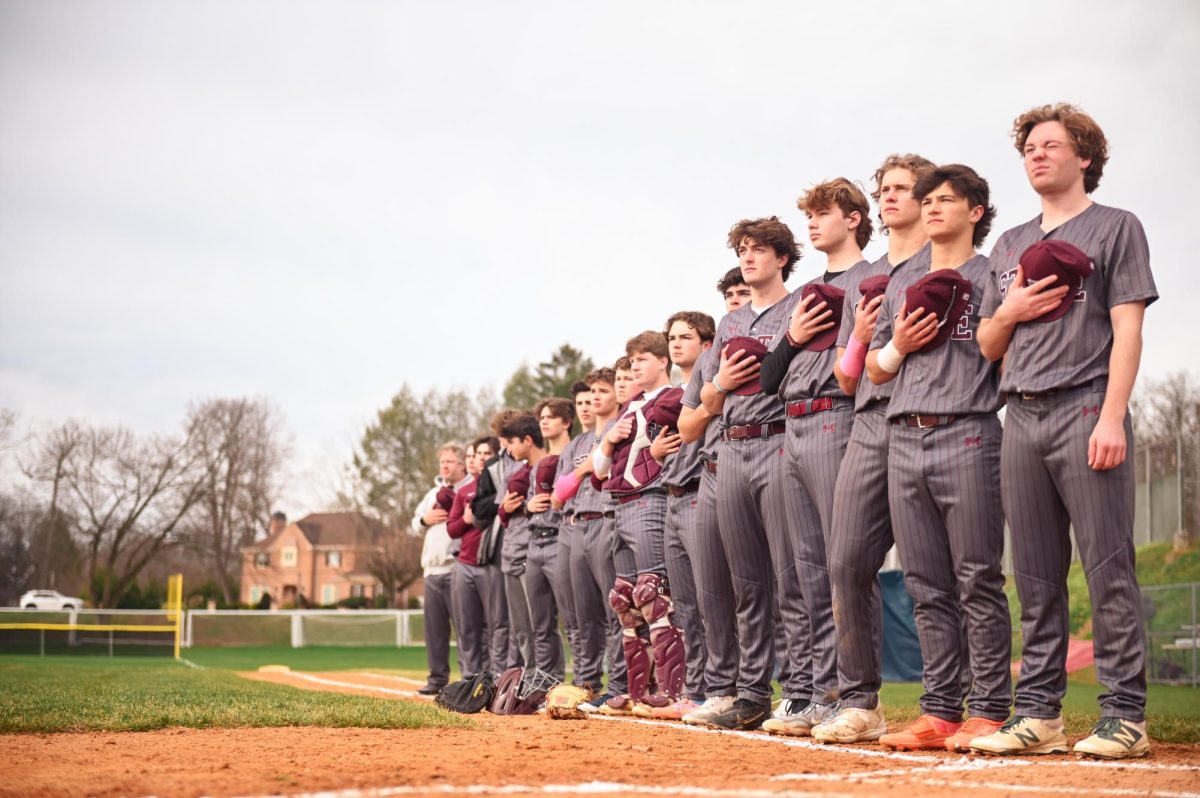 Players line up for the national anthem ahead of State College’s morning matchup against Altoona at State College’s Community Field, April 8th, 2024.