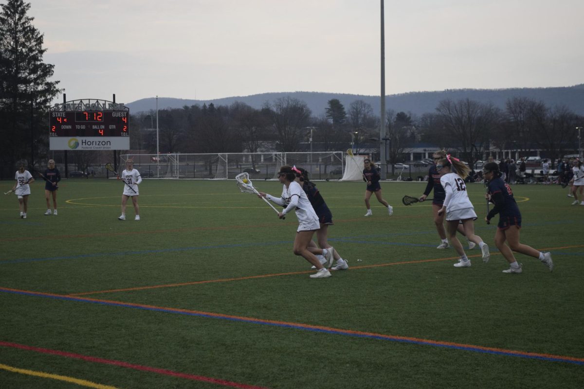 Sophomore Mckenna Kulka takes the ball away from Hershey during State College’s match vs. Hershey, on Friday, March 22nd, 2024 at State High’s North Turf. 