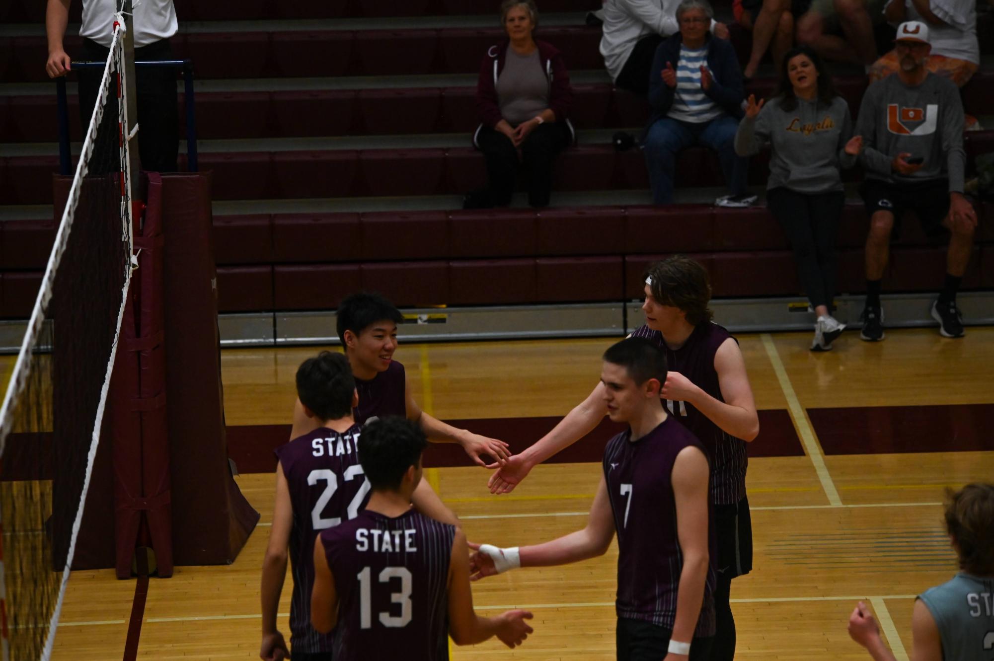 Varsity members celebrate after a win against Central Dauphin East. 
