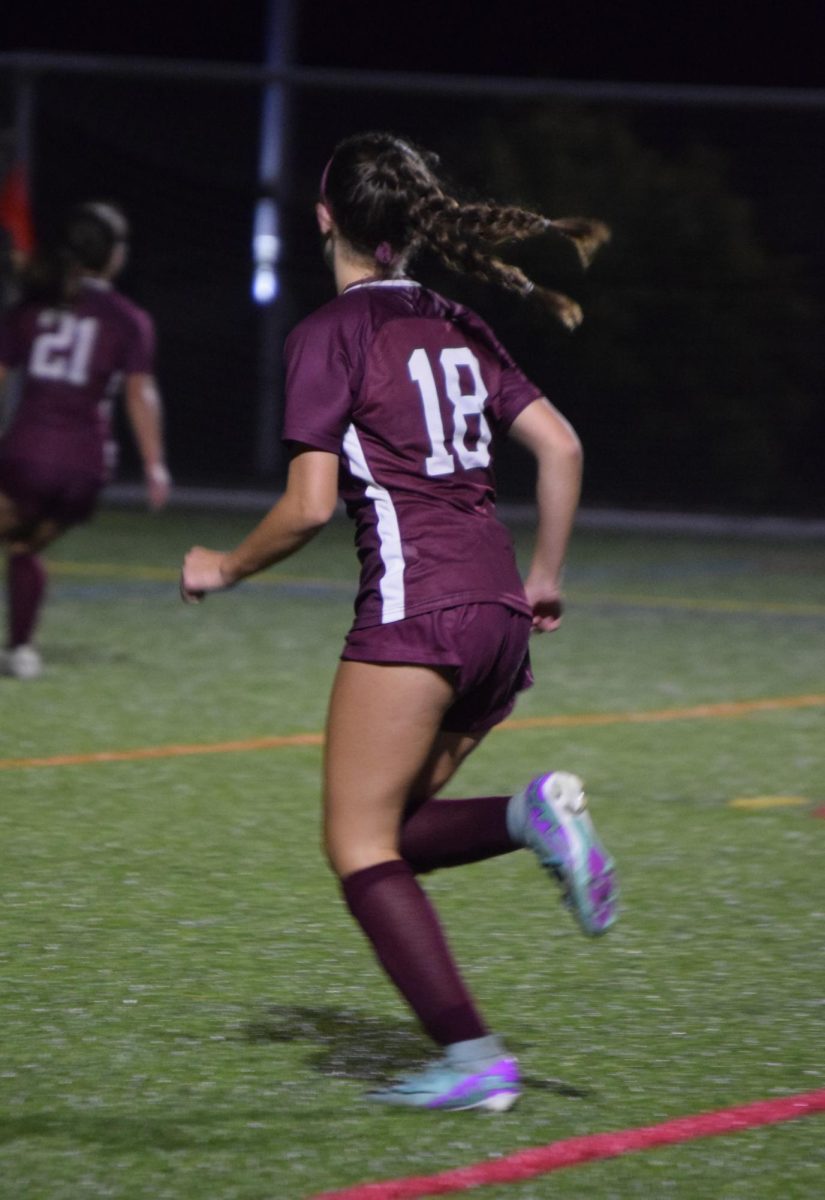 Freshman Kennedy Ayers chases down a loose ball in the second half. 