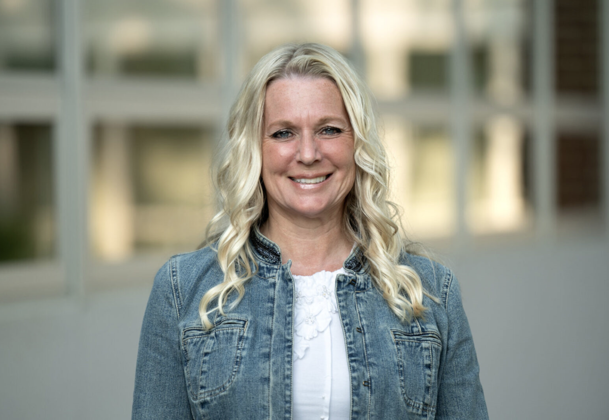 Susan Hipp stands in front of State High, ready to embrace her new role as assistant principal and make a lasting impact on students. | Courtesy of Nabil K. Mark