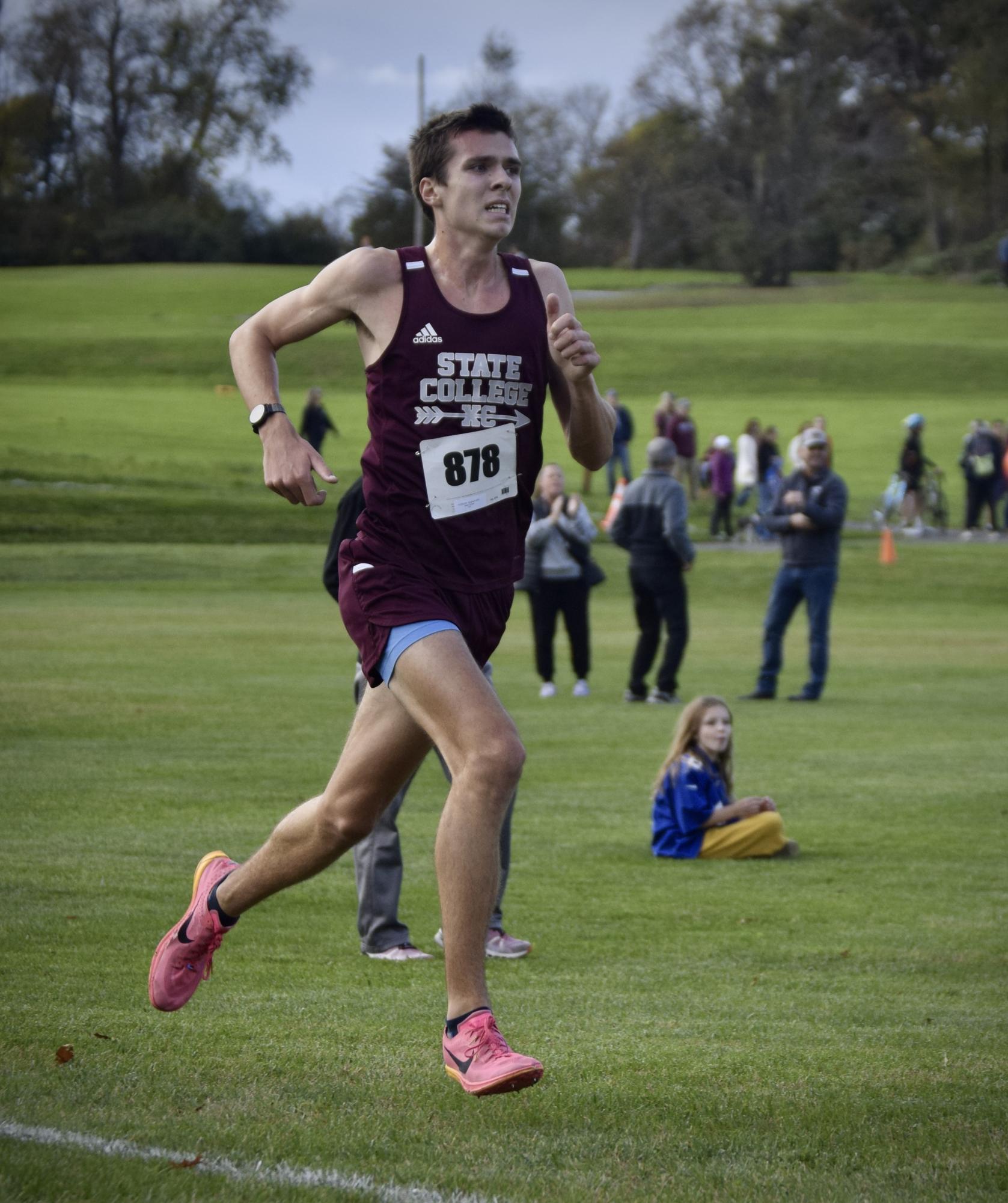 Senior Stephen Fowler digs for the finish line en route to setting a Circleville Park course record.