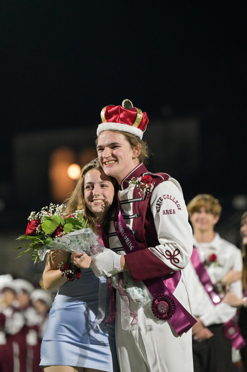 Genavieve Clayton and Luca Snyder embrace after being announced as Homecoming King and Queen.