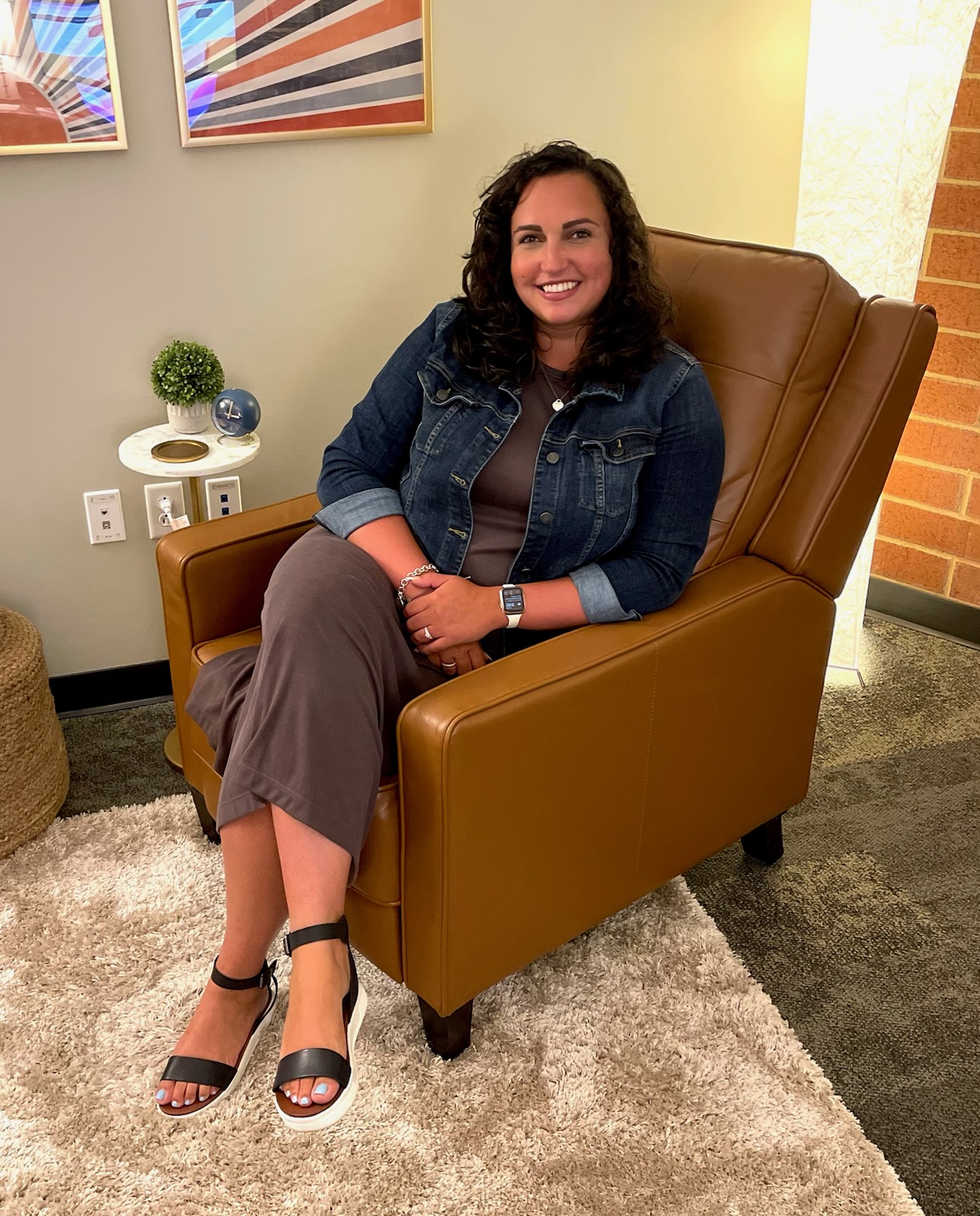 James smiles while sitting in her office. Photo courtesy of Elisabeth James.