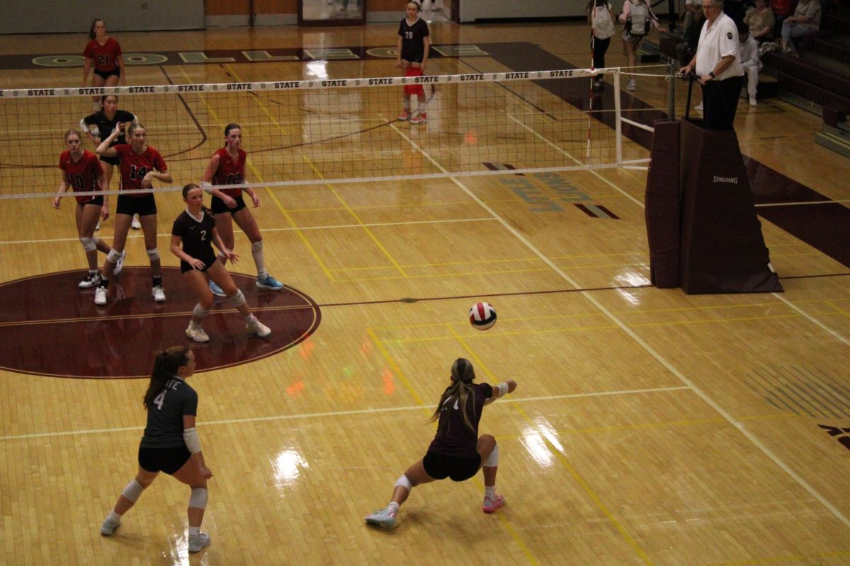 Junior Camryn Macneely (20) defends a ball during the second set against Cumberland Valley on Sept. 25.