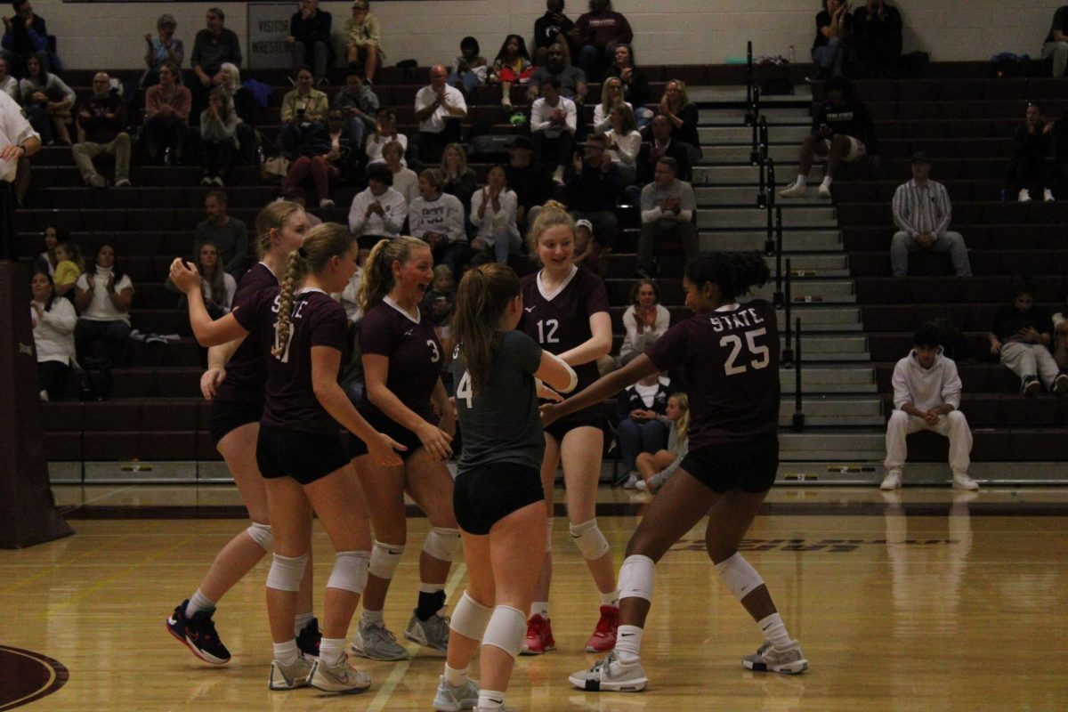 The Little Lions celebrate after senior Sarah Tate’s (25) ace early in the third set against Cumberland Valley. Tate happily danced to her point, while the other players on the court -- Jessie Campbell (12), Brynn Lally (4), Joslin Adams (17), Claire Renaud (13) and Annie Lamotta (3) -- came to applaud her.