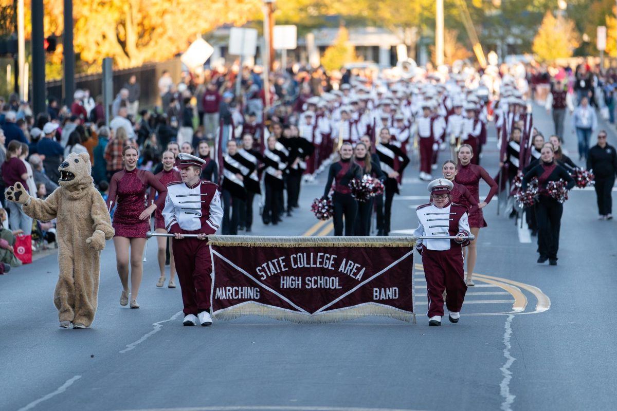 State High Marching Band walks towards the camera at the Homecoming Parade