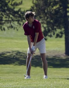 Junior Brady Wager lines up his club to shoot.