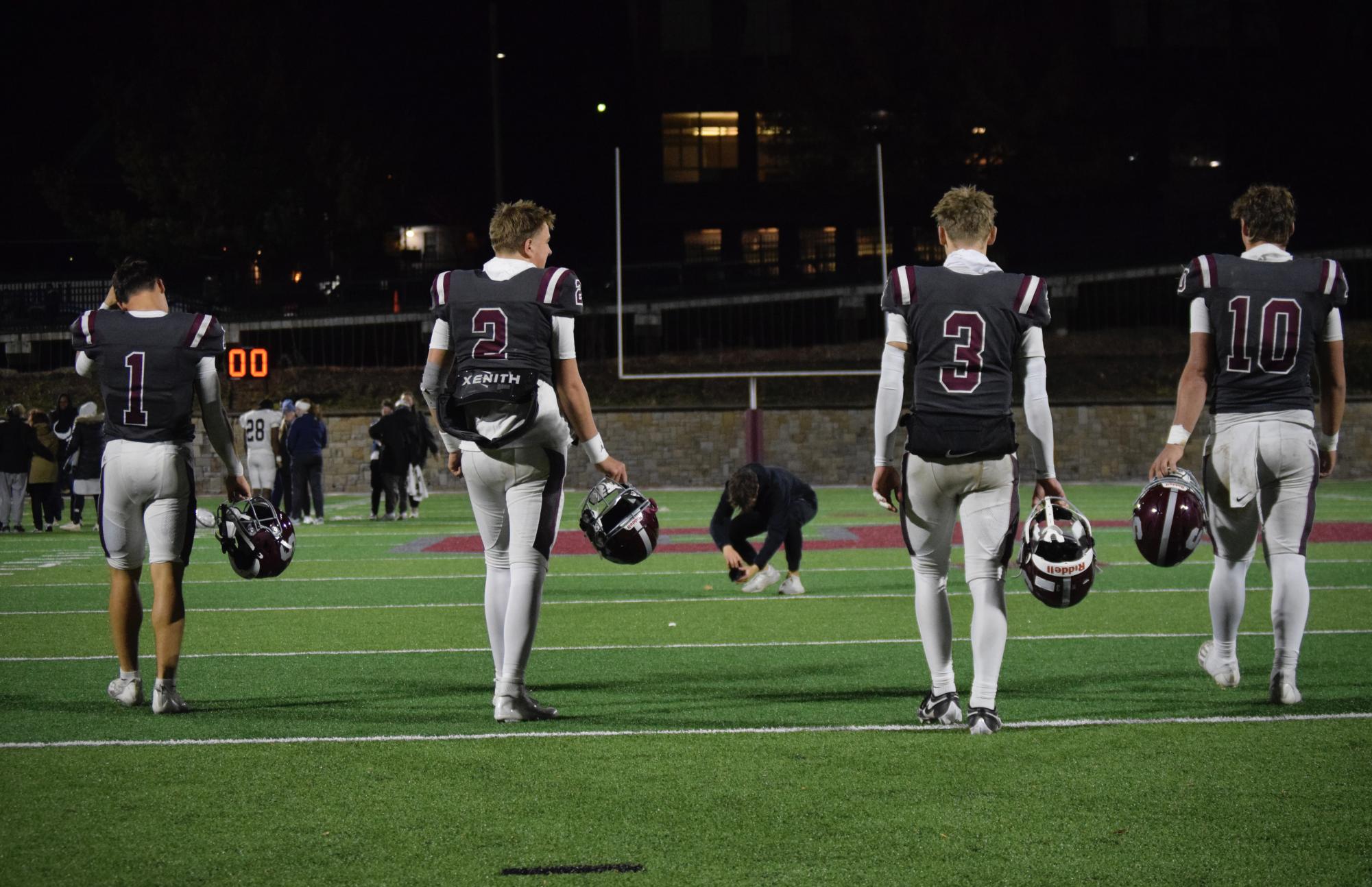 Seniors Cooper Brushwood, Eddie Corkery, Ty Salazer, and Michael Gaul walk the field one last time.