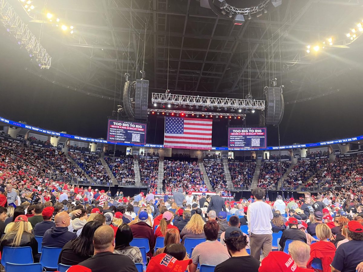 Supporters and audience members wait for Trump's arrival during his rally on Oct. 26. 