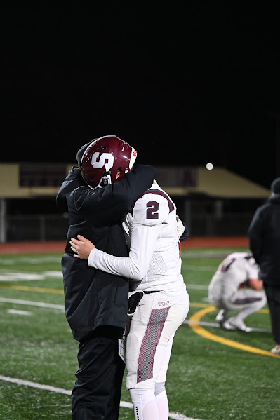 Eddie Corkery receives a hug from coach after season ending loss