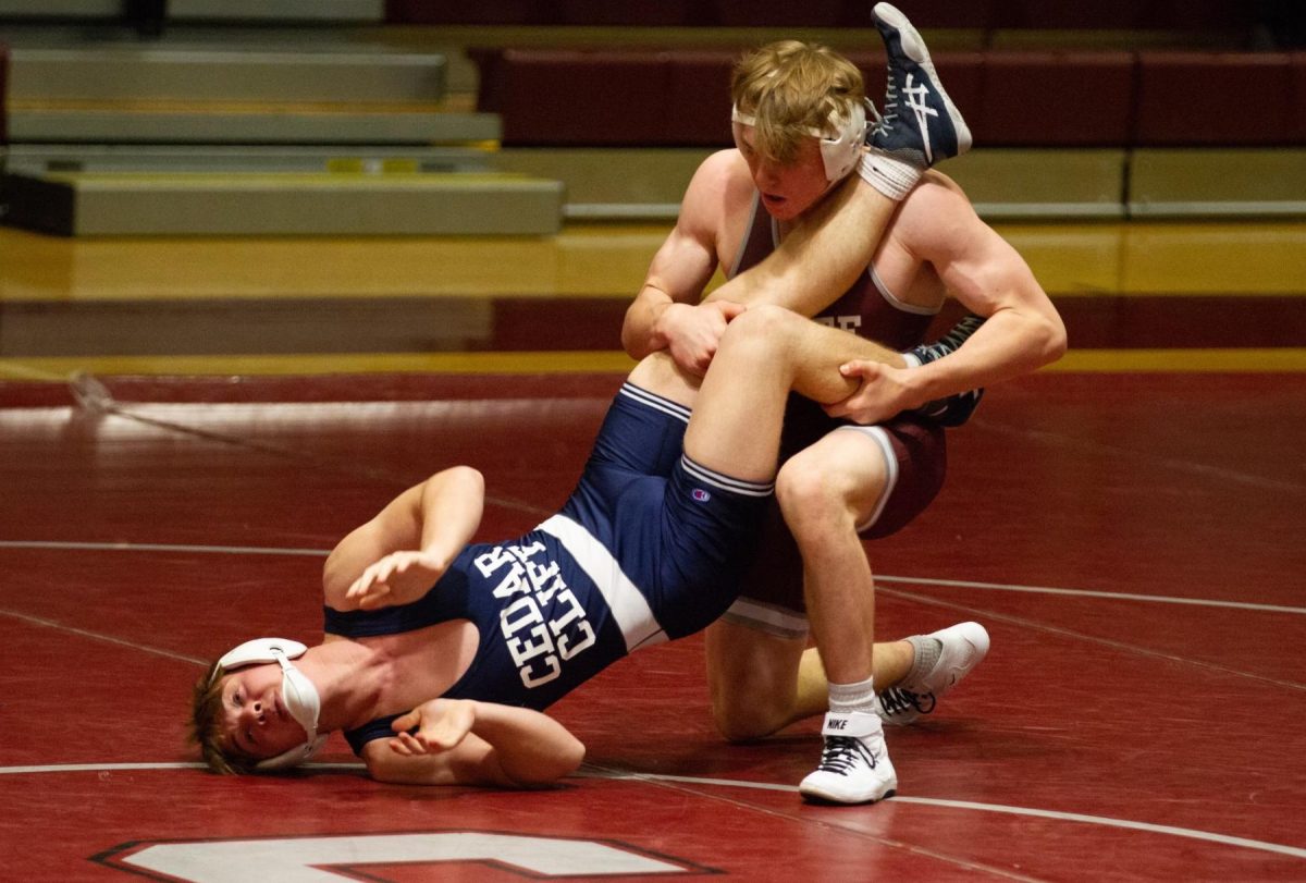 Senior Asher Cunningham wrestles against Cedar Cliff during the 2023-24 season. Photo courtesy of Tara Cunningham.